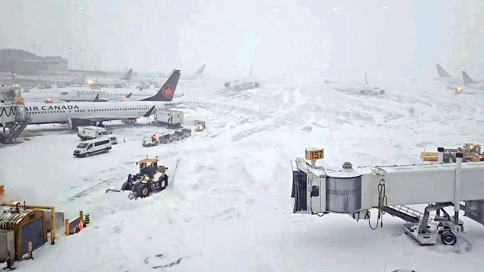 Delays and cancellations at Pearson Airport as crews try to keep runways clear