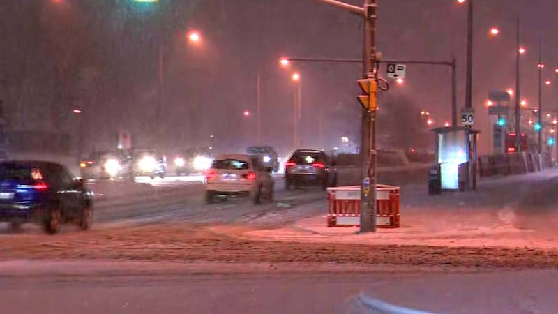Snow falls in Toronto on Wednesday, Dec. 10, 2025.